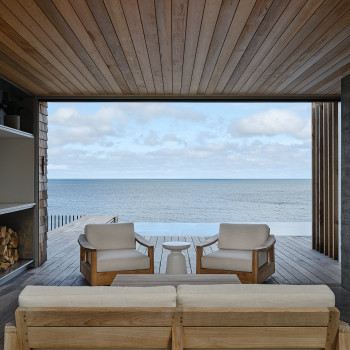 View of pool/ocean from covered patio